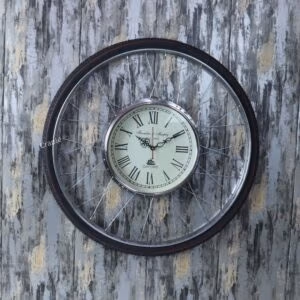 Large, round industrial wall clock with a bicycle tire design and an antique-style dial.