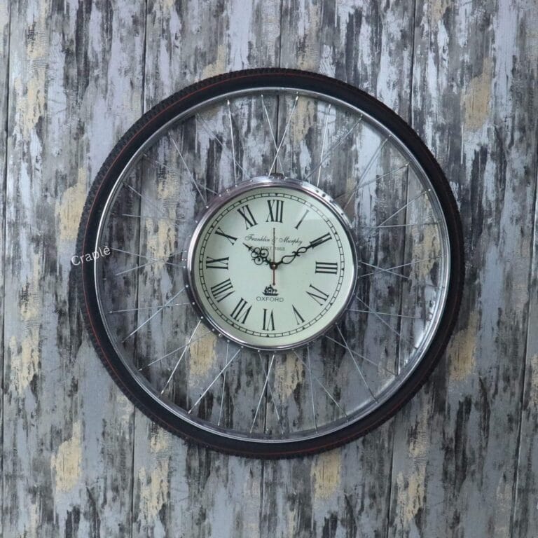 Large, round industrial wall clock with a bicycle tire design and an antique-style dial.