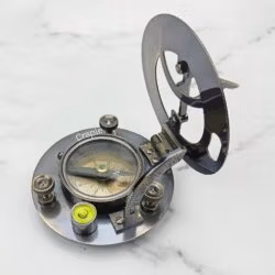 The black antique sundial compass with its lid open, revealing the internal magnetic compass and bubble level.