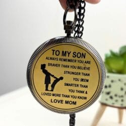 The back of the "To My Son" pocket compass with its heartfelt engraved message and attached chain.