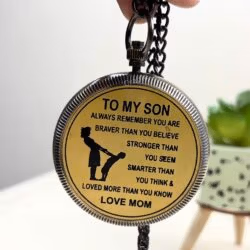 The back of the "To My Son" pocket compass with its heartfelt engraved message and attached chain.