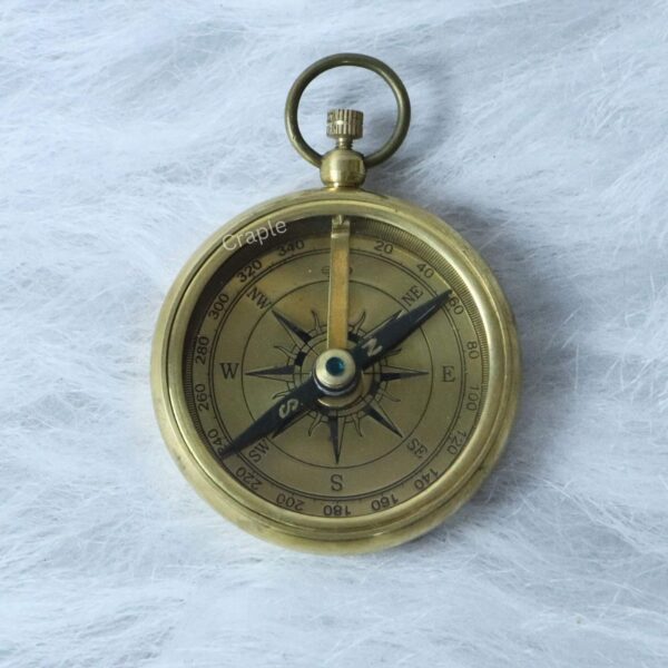 Classic Open Face Pocket Compass-3 Angled view of the classic brass compass, highlighting the detailed dial and the floating magnetic needle.