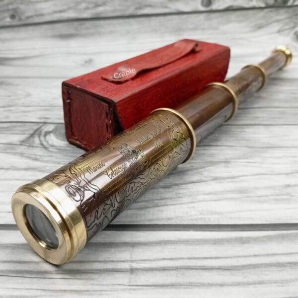 A partially extended brass spyglass with a leather grip, showing the eyepiece and objective lens.