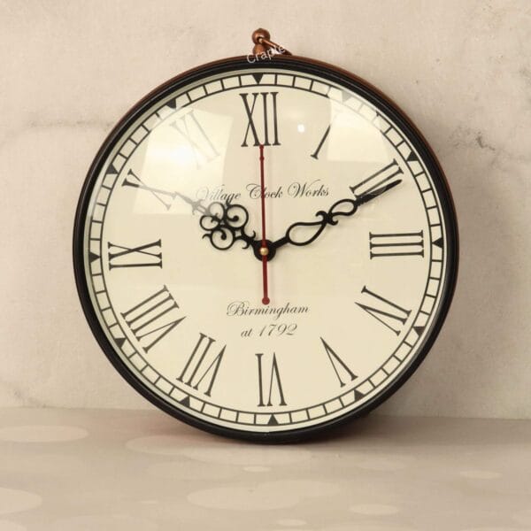 Close-up of a vintage station clock face with classic Roman numerals and ornate black hands.