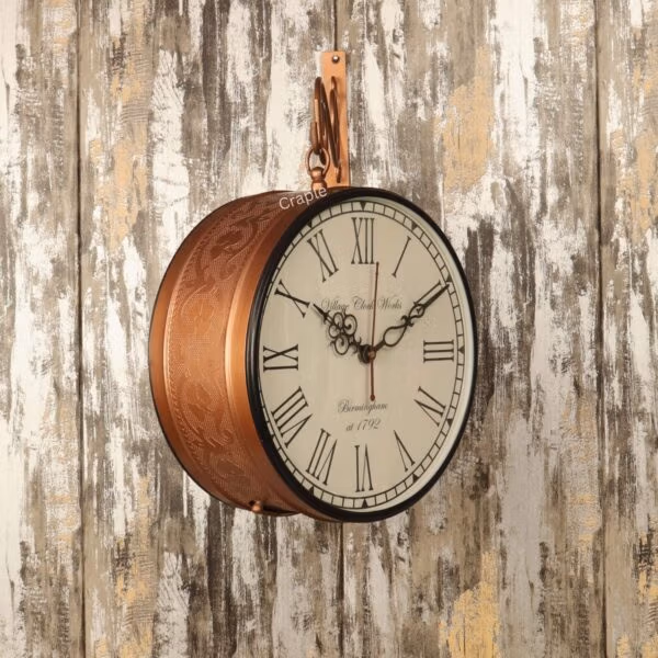 Side view of the hanging double-sided wall clock, showing its classic face and embossed brass-coated frame.