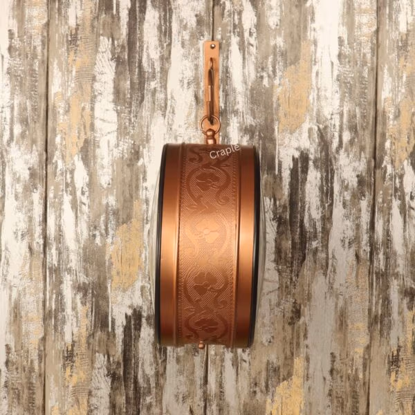 Detailed side profile of the station clock, showcasing the intricate embossed pattern on the brass-coated case.