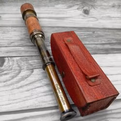 Antique-finish brass telescope with a leather-wrapped barrel, fully extended to reveal its multiple sections.
