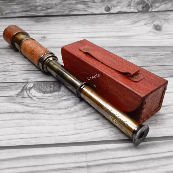 The Dollond London replica telescope fully extended to show its multiple brass sections and the eyepiece.