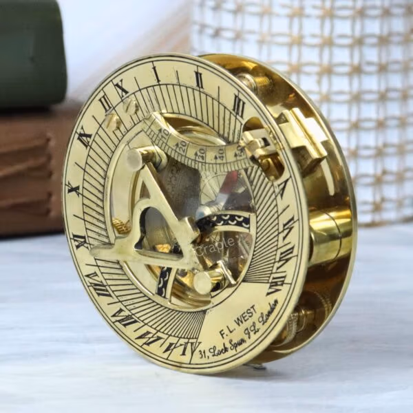 Side profile of the round brass sundial compass, showing the depth of the casing and the folded gnomon.