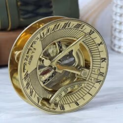 Three-quarter view of the F.L. West pocket sundial compass, focusing on the adjustable latitude arc.