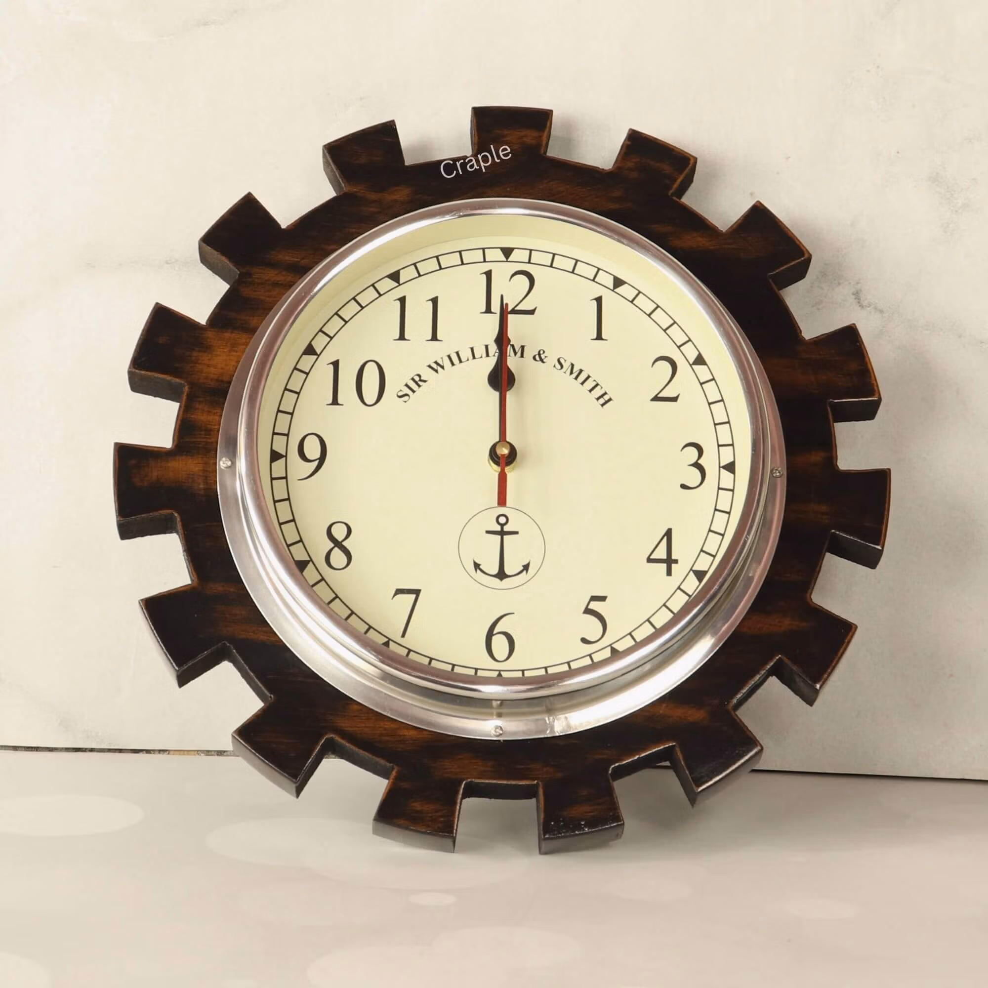 Gear-Shaped Wall Clock-1 Industrial gear-shaped wooden wall clock with a polished aluminum bezel and a nautical-themed cream dial.