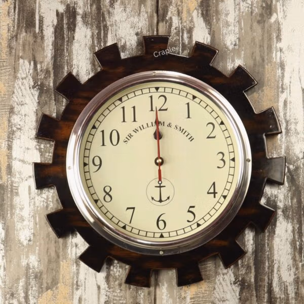The gear-shaped nautical wall clock mounted on a rustic, distressed wooden background.