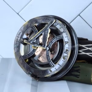 Antique brass sundial compass by Gilbert & Sons with a black finish, featuring a folding gnomon and a detailed compass dial.