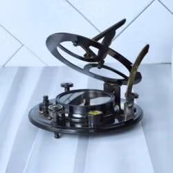 Gilbert & Sons sundial compass with its gnomon and latitude scale fully extended for use.