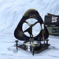 Side profile of the open brass sundial compass, highlighting the three adjustable screw legs for leveling.