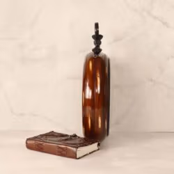 Side profile of the large wooden wall clock, highlighting its deep body and glossy brown finish.