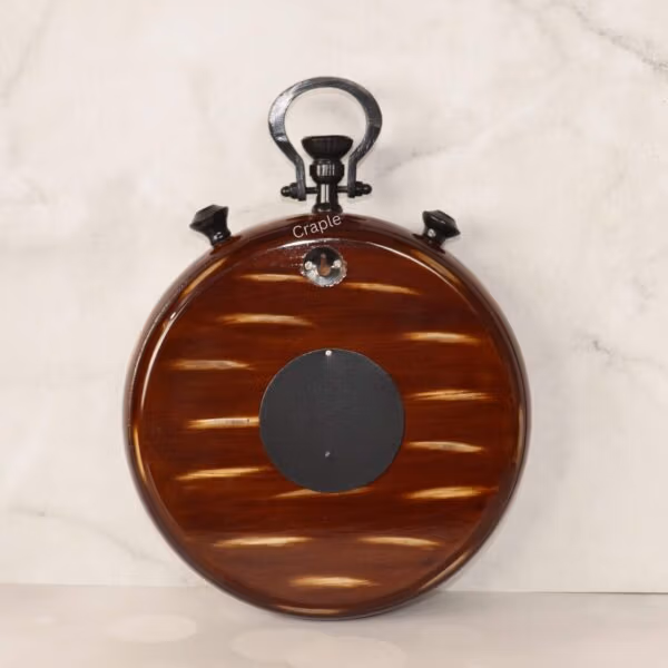 The back of the stopwatch-style wall clock, showcasing the beautiful brown wood grain finish and hanging mechanism.