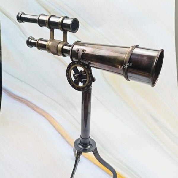 Side profile of the decorative brass telescope, highlighting its antique finish and adjustable tripod base.