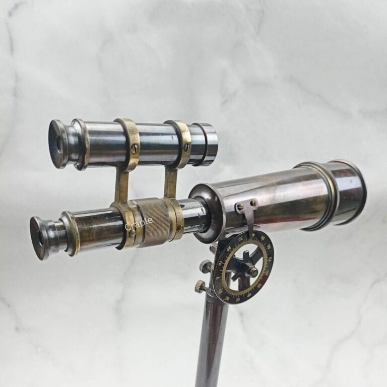 Antique brass Kelvin & Hughes double-barrel telescope on its adjustable tripod, showcasing its elegant nautical design.