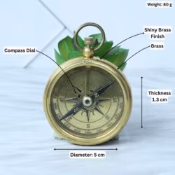 Brass pocket compass with its specifications labeled: 5 cm diameter, 1.3 cm thickness, and 80g weight.