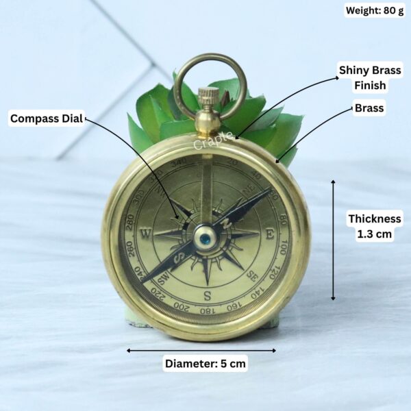Brass pocket compass with its specifications labeled: 5 cm diameter, 1.3 cm thickness, and 80g weight.