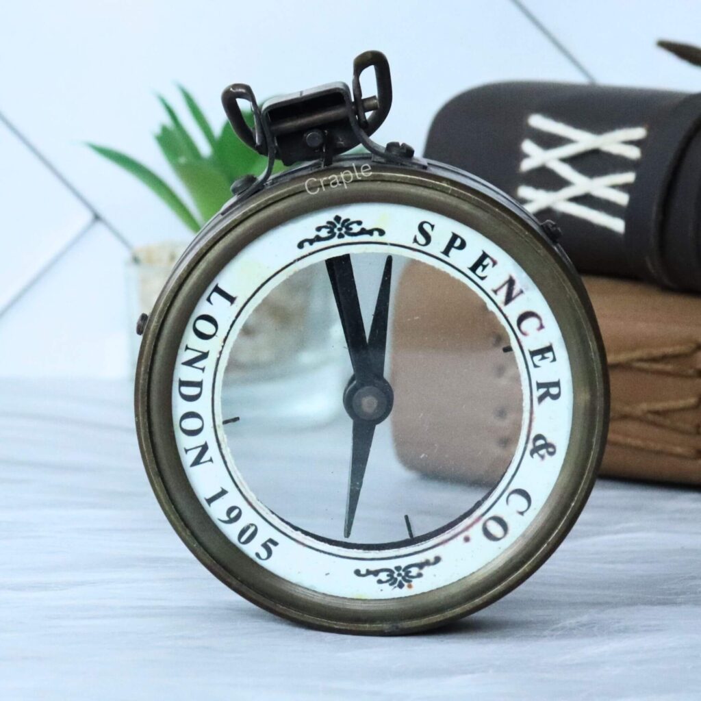 Vintage Spencer & Co. London map reader compass with a magnifying glass lens and an antique brass finish.