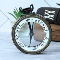 Vintage Spencer & Co. London map reader compass with a magnifying glass lens and an antique brass finish.