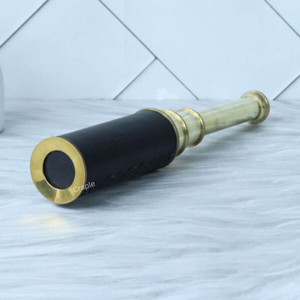 Nautical Vintage Marine Handcrafted Telescope-2 Vintage brass and leather spyglass, partially extended to show the polished brass barrels.