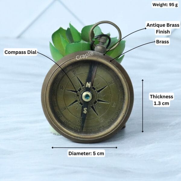 Antique brass compass with its dimensions labeled, showing a 5 cm diameter, 1.3 cm thickness, and 95g weight.