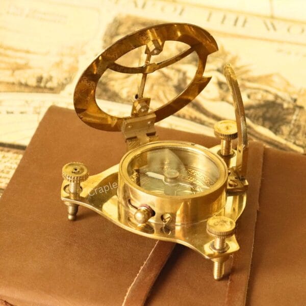 Side view of the West London sundial, highlighting the internal liquid-damped compass and brass casing.