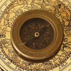 Close-up of the vintage-style compass dial featuring an ornate compass rose and a "London 1941" engraving.