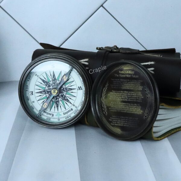 Open Stanley London pocket compass with a black antique finish, displaying the internal compass dial and the engraved lid.