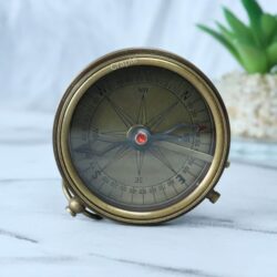 The Stanley London pocket compass opened to show the vintage-style compass dial with cardinal points.