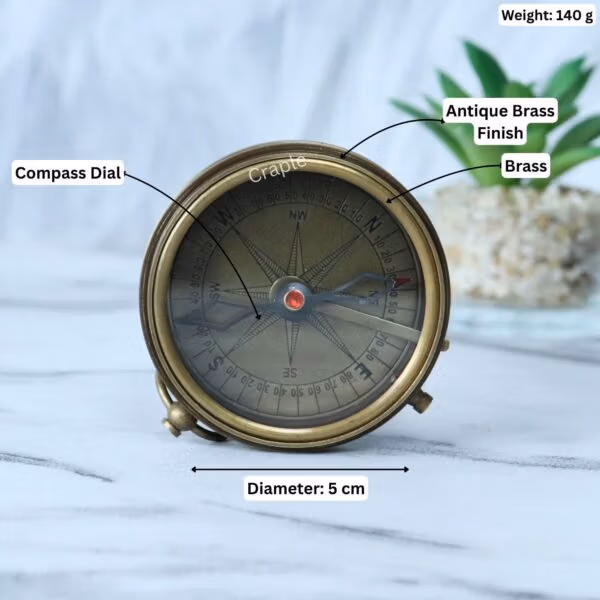 Stanley London pocket compass with its dimensions labeled, showing a 5 cm diameter and 140g weight.
