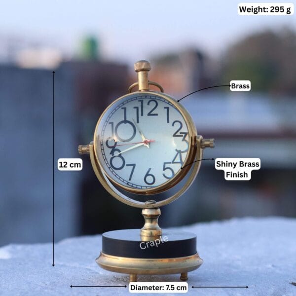 Tilting Orb Shiny Brass Desk Clock-8 Product image of the brass orb clock with dimensions: 12 cm height, 7.5 cm diameter, and 295g weight.