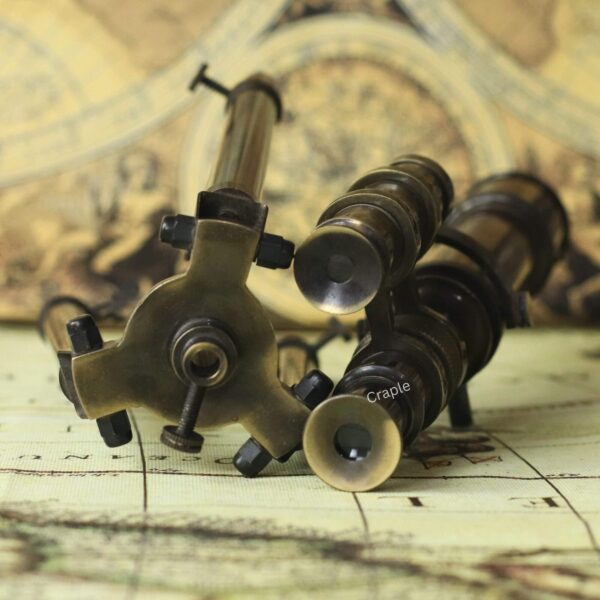 Top-Mounted Double Barrel Telescope Antique Brass-6 Top-down view focusing on the eyepieces of multiple decorative brass telescopes.