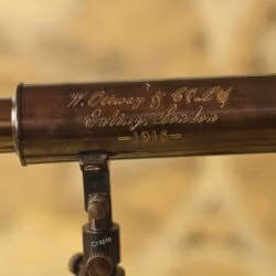 Detailed close-up showing the "W. Ottway & Co Ld, Ealing, London - 1915" engraving on the brass telescope barrel.