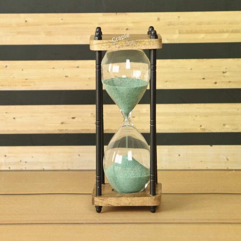 A rustic 10-minute hourglass with dark green sand, framed by natural wood and black antique-finish brass pillars.