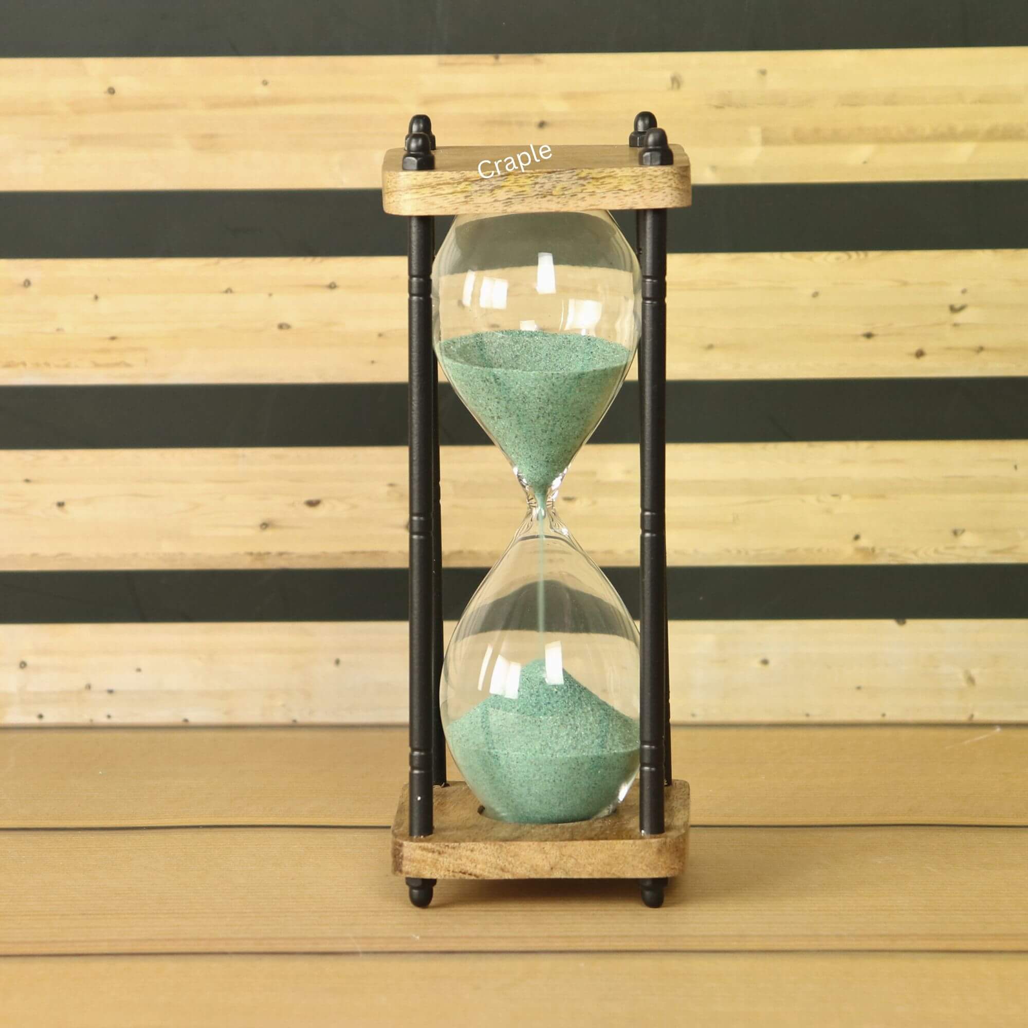 10-Minute Natural Wood & Brass Sand Timer-1 A rustic 10-minute hourglass with dark green sand, framed by natural wood and black antique-finish brass pillars.