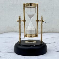 Front view of the 3-minute white sand hourglass, showcasing its polished brass pillars and pivoting frame.