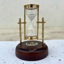 A classic front view of the 3-minute hourglass, showing the brass frame, white sand, and dark wooden base.