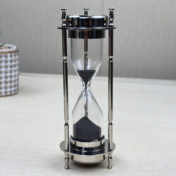 A 3-in-1 desktop accessory with a nickel-finish brass frame, shown as a 3-minute black sand hourglass.