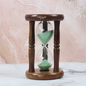An antique-style 5-minute hourglass with a polished rosewood frame, turned pillars, and light green sand.
