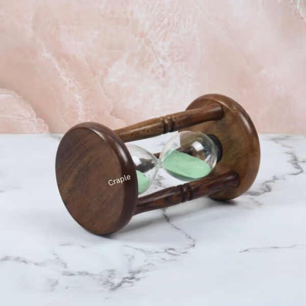 Angled view of the 5-minute sand timer lying down, highlighting its classic wooden construction.