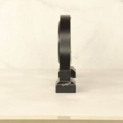 Side profile of the black wooden desk clock, highlighting its sturdy base and elegant silhouette.