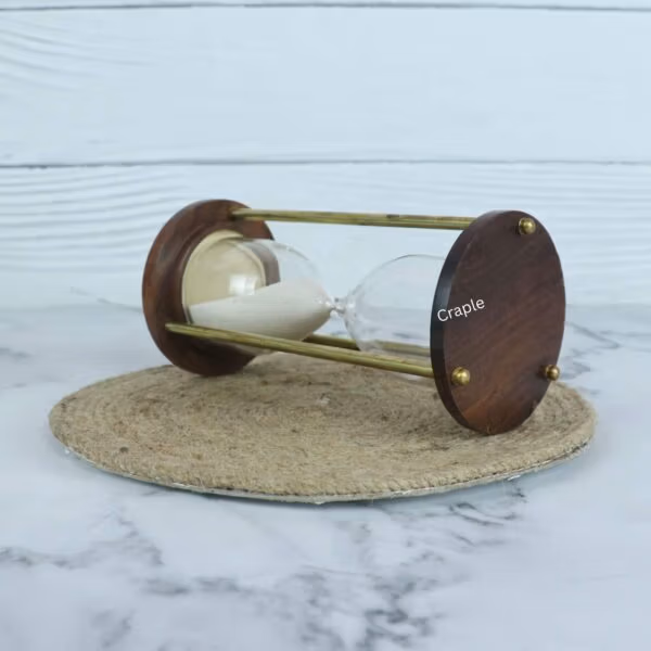 Close-up of the wooden base of the 3-minute sand timer, highlighting the smooth finish and brass details.