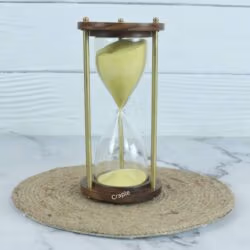 A classic 3-minute hourglass with bright yellow sand, framed by dark wooden bases and brass pillars.