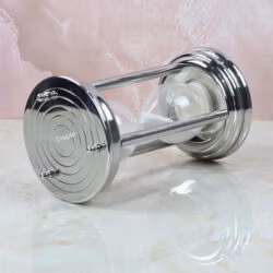 The 10-minute steel hourglass resting horizontally, showcasing its sturdy pillar construction and white sand.