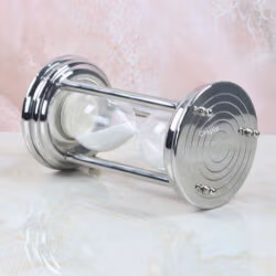 Angled side view of the modern steel sand timer, highlighting its reflective, polished finish.