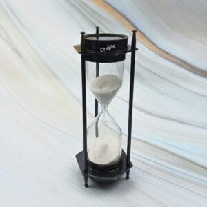 Vintage-style 3-minute hourglass sand timer with a built-in compass, crafted from brass with a black antique finish.
